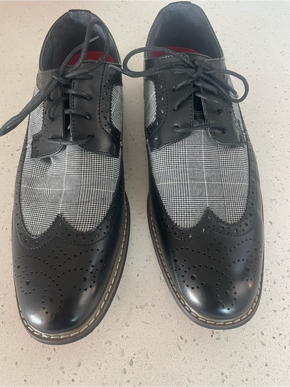 Parrano brand shoes feature a distinct black and white plaid tweed pattern.